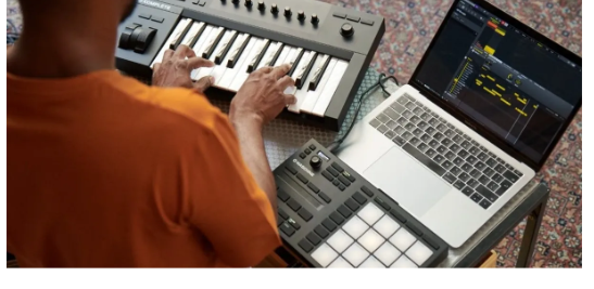 Overhead view of a DJ setup with hands on the decks